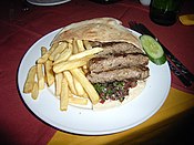 Egyptian cigar-shaped kofta stuffed in a pita