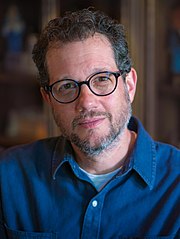 A picture of Michael Giacchino smiling towards the camera