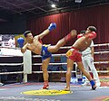 High kick and a dodge in Khmer boxing match