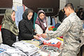 Female vendors at a small bazaar selling items to U.S. Air Force personnel, 2010