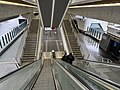 The escalators and stairs viewed halfway down from the platform to the concourse, October 2024