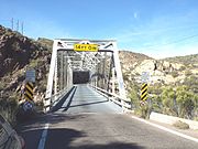 Historic Mormon Flat Bridge built in 1924 and located on Highway 88 over Willow Creek, 3.8 miles west of Tortilla Flat. The bridge was listed in the National Register of Historic Places in September 30, 1988, reference #88001598.