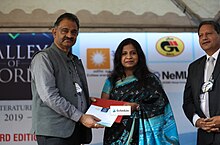 Author Archana Sarat receiving the VoW Book Award 2019 for her book Tales from the History of Mathematics.[1][2]