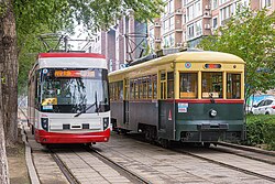 Two trams (one in historical config) near Changjiu Road station