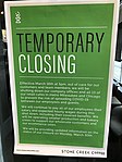 A sign for a Milwaukee/Chicago coffee shop chain in their Oconomowoc location indicates that the business has closed, their manufacturing operations will be unaffected, and employees will continue to be paid (the closure date on the sign has since extended further to the end of the stay-at-home order).