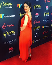 Image of Dinka Džubur in a red dress on the red carpet at the 7th AACTA Awards.