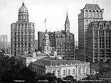 Looking east from New York City Hall in 1906; 150 Nassau Street is in the background at right, behind 41 Park Row. The former New York World Building (left) and New York Tribune Building (center) are also visible