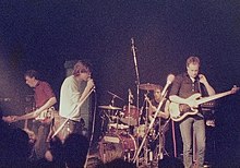 Karl Burns (second from right, with the drums) performing as part of The Fall in 1984