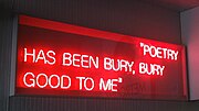 Poet Ron Silliman's neon sculpture From Northern Soul (Bury Neon) is displayed at the entrance to Bury Interchange.