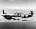 A Kittyhawk of No. 16 Squadron in flight over the New Zealand coastline