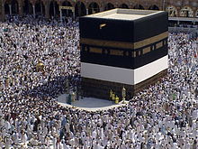 Aerial view of a large crowd around a square building