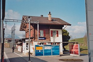 Three-story building with gabled roof