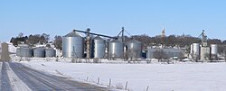 Tarnov seen from the east. In the foreground are grain bins along the Nebraska Central Railroad track; on the hill right of center is the steeple of St. Michael's Catholic Church, February 2010