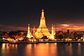 Image 30Wat Arun, the most prominent temple of the Thonburi period, derives its name from the Hindu god Aruṇa. Its main prang was constructed later in the Rattanakosin period. (from History of Thailand)