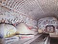 Reclining Buddha in cave 148, second largest reclining figure in Mogao. High Tang period.