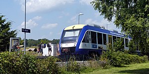 White-and-blue train at side platform
