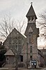 Photograph of All Saints Episcopal Church from its front, also capturing its spire.