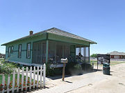 The McCroskey House was built by George Edwards in 1917 and was originally near Pecos and Dobson Roads. The house was sold to the McCroskey family and is located at Tumbleweed Park at 2250 S. McQueen Road. It is listed as historic by the Chandler Historical Society.