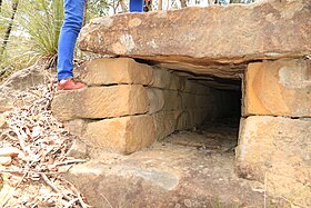 Convict-built road, Mount McQuoid, Great North Road, Bucketty, NSW. Stone box-drain culvert beneath road.
