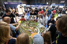 Science Fair visitors around superconducting model