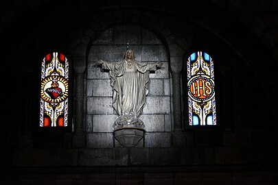 Stained Glass and statue of Christ in the crypt