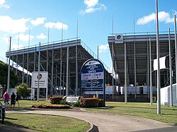 View of a stadium's exterior, with its support columns and seating bowl visible