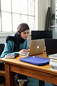 A participant researching material during the Cornell University 2017 Art + Feminism Wikipedia edit-a-thon. Fine Arts Library, March 11, 2017.