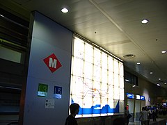 Large illuminated metro map at entrance to the metro station from the main line concourse