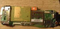 The backside of the mainboard, exposing the SIEMENS GSM Module, and SD Card slot