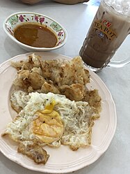 โรตี(Lo-ti)指印度煎餅roti canai，成為布吉人的早午茶