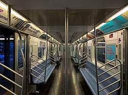 The empty interior of a newer R142A car on the 5 train