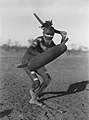 Image 3A Luritja man demonstrating method of attack with boomerang under cover of shield (1920) (from Culture of Australia)