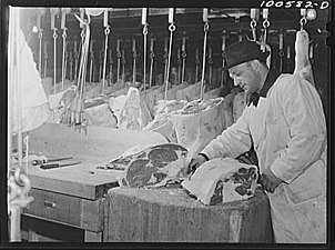 Cutting beef in the District Grocery Store warehouse