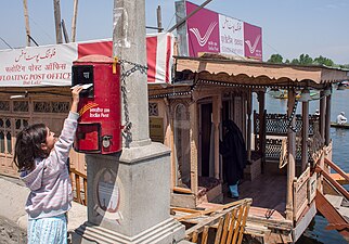 A girl posting a Postcard