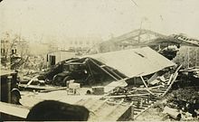 Picture depicting damage to a car dealership