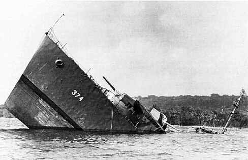 USS Tucker, a Mahan-class destroyer, sinking after striking a mine while escorting a cargo ship into New Hebrides, 1942