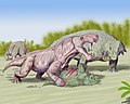 狼蜥兽攻击一群锯齿龙类，属于丽齿兽亚目
