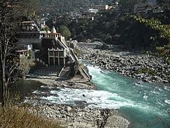 Confluence of Alaknanda (background) and Mandakini (foreground) at Rudraprayag. In the 2013 Uttarakhand floods, after the Mandakini ravaged its banks, all the structures below the Chamundi temple have been seriously damaged and the large boulder called Narad Shila has disappeared while a long line of stones have appeared along the confluence.