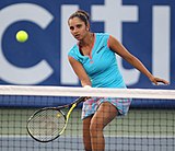 Q-45 (Tennis) Indian tennis player Sania Mirza returning the ball at the Citi Open Tennis 2011.