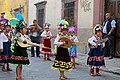 Children holding concheras; following the traditions of the shell dances, these children parade in the streets of San Miguel de Allende.