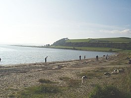 A curved bay with a sandy foreshore