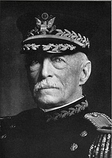 Black and white head and shoulders photo of John M. K. Davis in dress uniform and cap, facing left