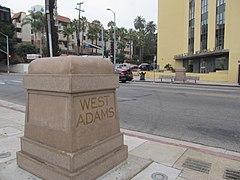 West Adams concrete marker in front of the Golden State Mutual Life Insurance Building, 2021.