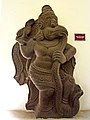 A 13th-century sculpture from Bình Định shows Garuda devouring a serpent.