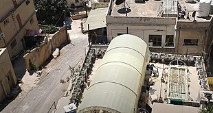 A hilly neighborhood zone on the Hatem al-Tai Stairs