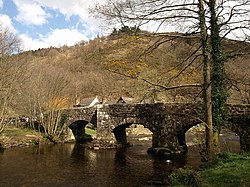 a picture of the bridge showing its stone piers and three arches with pedestrian refuges above the piers