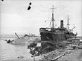 MV Anshun lying on her side at Gili Gili Dock, in Milne Bay, New Guinea, 1942