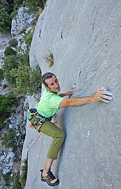 A climber using the smearing technique on outdoor rock