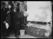 Secretary of State Charles Evans Hughes troweling mortar for the cornerstone of National Baptist Memorial Church, 22 April 1922, Library of Congress, Harris & Ewing Collection