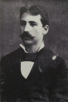 Photograph of a young man with a moustache.